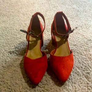 Gently worn red heels